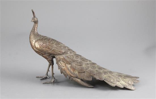 A Japanese silvered copper-bronze figure of a peacock, Meiji period, length 25cm, lacking base